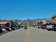 A thumb nail view of Grand Lake, Colorado during Constitution Week in September looking at Grand Avenue looking west before it all begins with the Garrison Flag stretched across on parade day; click here to open a window with a larger picture.